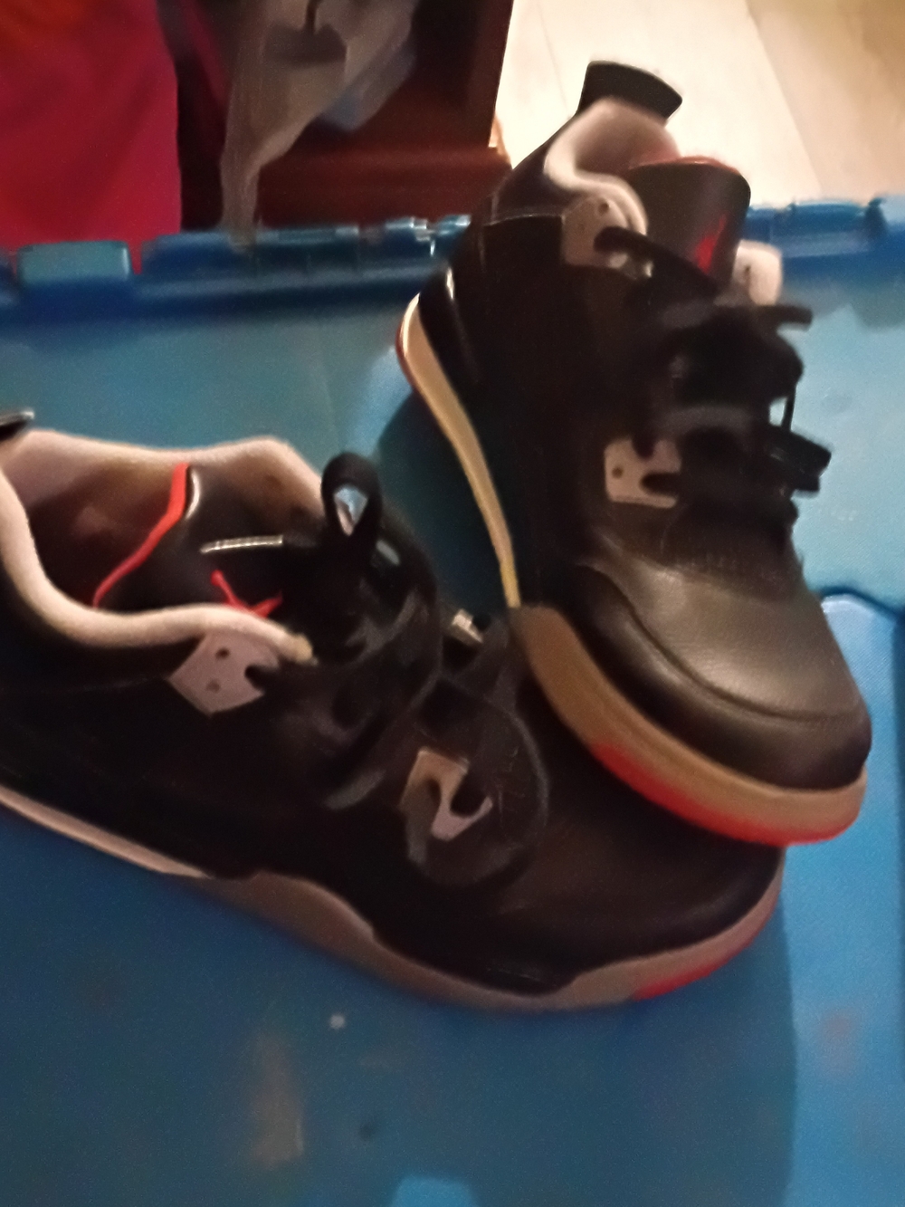 Kids Air Jordan 4 Retro "Bred Reimagined" Black Sneakers with Red Trim -